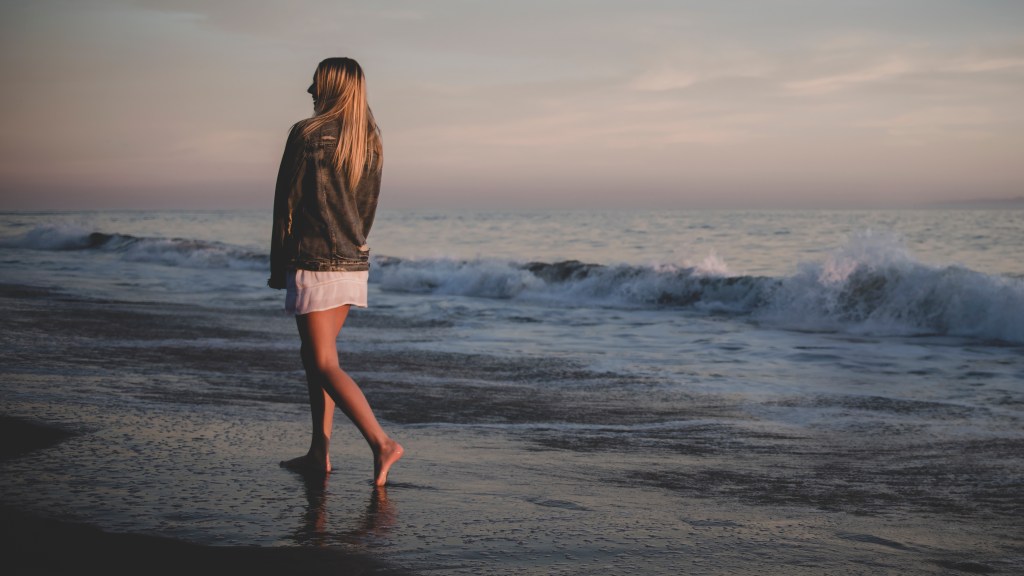 Woman walking on beach
