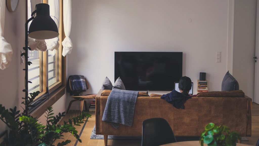 Woman on sofa engaging in sedentarism