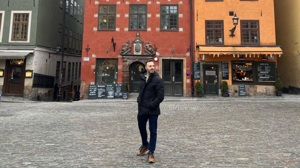 Chris Carra outside fika cafes in Stockholm