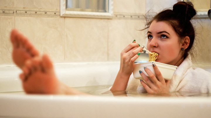 Woman in bath eating too quickly